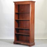 A reproduction mahogany standing open bookcase,
