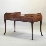 A good quality 1920's burr walnut writing table, on cabriole legs,
