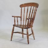 A 19th century elm splat back armchair