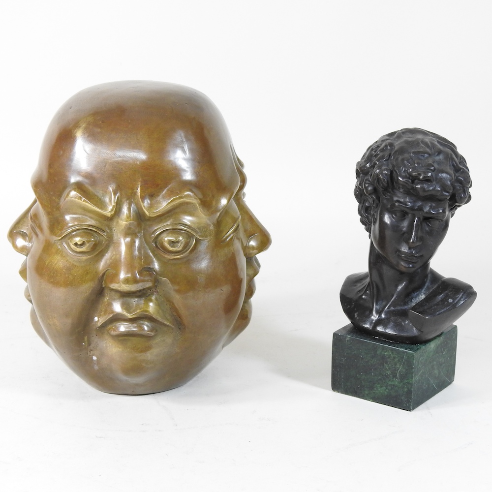 A modern bronze bust of a roman, on a marble base, together with a brass four face Buddha,