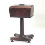 A 19th century mahogany teapoy, on a platform base,