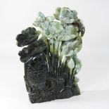A Chinese carved jade coloured hardstone carving of fish,