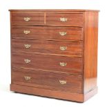 An Edwardian walnut chest of drawers, of large portions, on a plinth base,