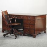 A reproduction mahogany pedestal desk, with a brown inset top, 152cm,