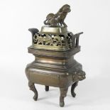 A bronze censer, surmounted by a dog of fo,
