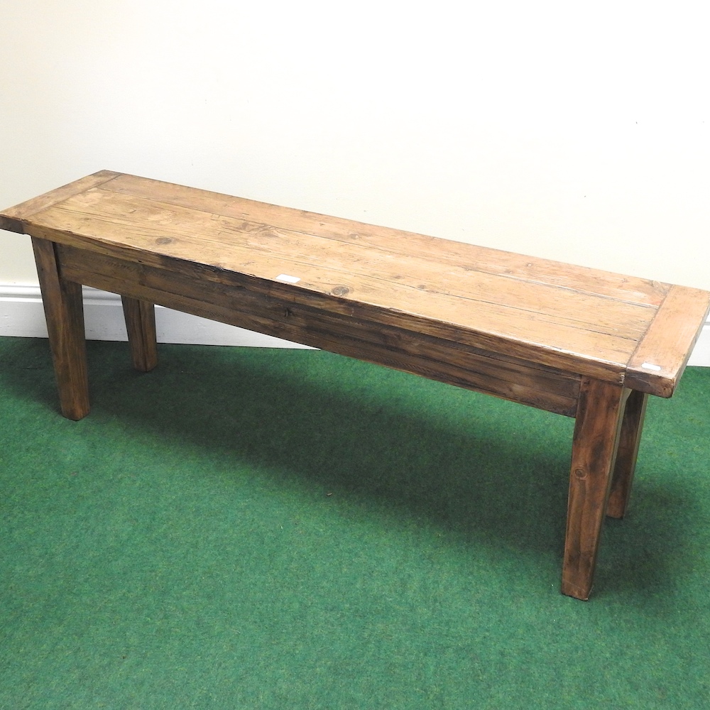 A stained pine bench,