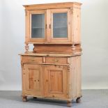 A 19th century pine dresser, with a glazed upper section,