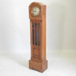 A 1920's oak cased grandmother clock,