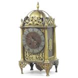 An early 20th century Danish brass cased lantern clock, with scrolled decoration,