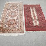A woollen rug with three central medallions, on a cream ground, 200 x 90cm,
