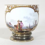 An 18th century Meissen porcelain silver plated mounted cup, reserved with figures in a harbour,