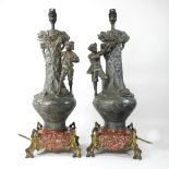 A pair of early 20th century spelter figural table lamps, on marble bases,