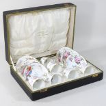 An early 20th century Crown Derby porcelain coffee service, in a fitted case,