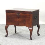 A 19th century mahogany wine cooler, on cabriole legs, with a removable metal liner,