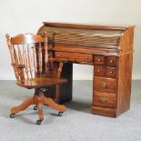 A modern hardwood desk, with a tambour front, 122cm,