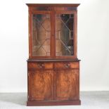 A reproduction cabinet bookcase,