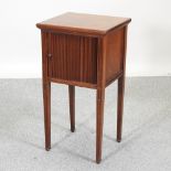 A 19th century mahogany bedside cupboard, with a tambour door,