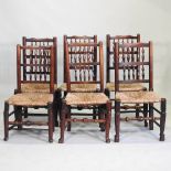 A set of six 19th century rush seated spindle back dining chairs