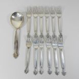 A set of twelve Danish silver table forks by Georg Jensen, each having a scrolled terminal,