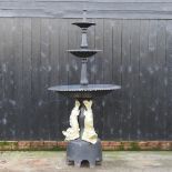 A large Victorian style black and gold painted cast iron garden fountain,