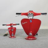 A large modern red painted table lamp, in the form of a vespa, 61cm high,