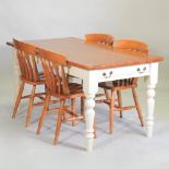 A pine kitchen table on a white painted base, containing a single drawer,160 x 85cm,