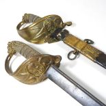A 19th century Naval officer's sword, having a curved steel blade,