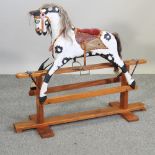 A mid 20th century painted wooden rocking horse,