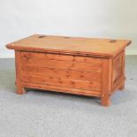 A pine blanket box, with a hinged lid,