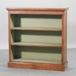 A walnut and crossbanded hand made dwarf open bookcase, with a painted interior,