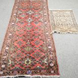 A Hamadan runner, with floral design, on a red ground, 280 x 94cm,