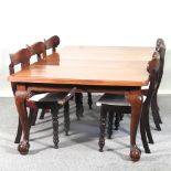 A 1920's mahogany wind-out extending dining table,