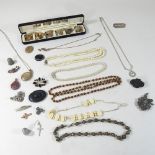 A collection of costume jewellery, to include brooches,