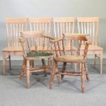 A set of four fruitwood dining chairs,