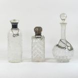 An early 20th century Danish decanter and stopper, with a silver collar, 24cm high,