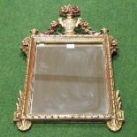 A modern gilt framed wall mirror, surmounted by an urn,