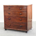 A Victorian mahogany chest of drawers, on bun feet,