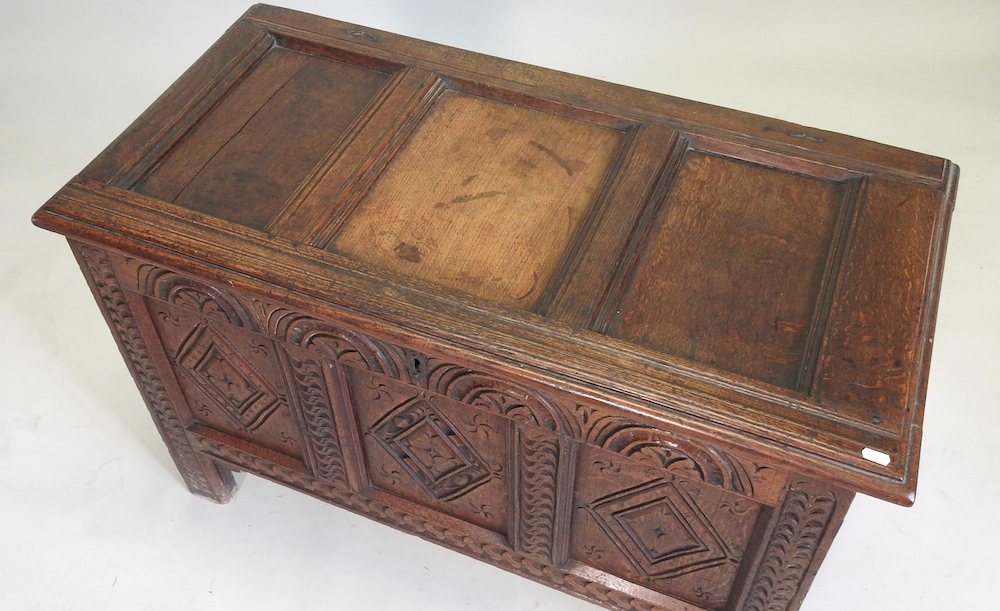 An 18th century and later carved oak coffer, - Image 3 of 15