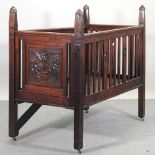 A 19th century carved mahogany child's bed,