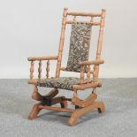 A 19th century style beech children's American rocking chair,