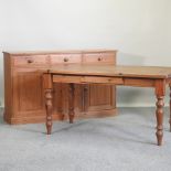 A modern pine sideboard, 152cm, together with a pine kitchen table,