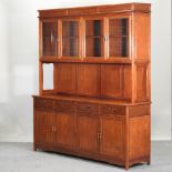 A 20th century Chinese hardwood bookcase, with a glazed top,