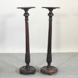 A pair of 19th century turned mahogany jardiniere stands,