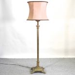 A brass Corinthian column standard lamp and shade,