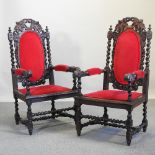 A pair of large 19th century carved oak and red upholstered throne chairs