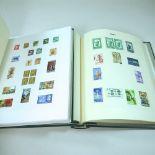 Two albums of 19th century and later British and all world stamps,