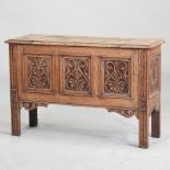 An early 20th century stripped oak coffer,