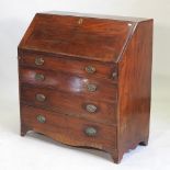 A George III mahogany bureau, on bracket feet,