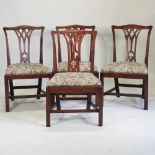 A set of four George III mahogany dining chairs,