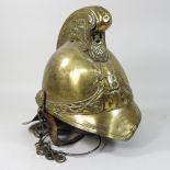 A 19th or early 20th century brass Merryweather fire fighter's brass helmet,
